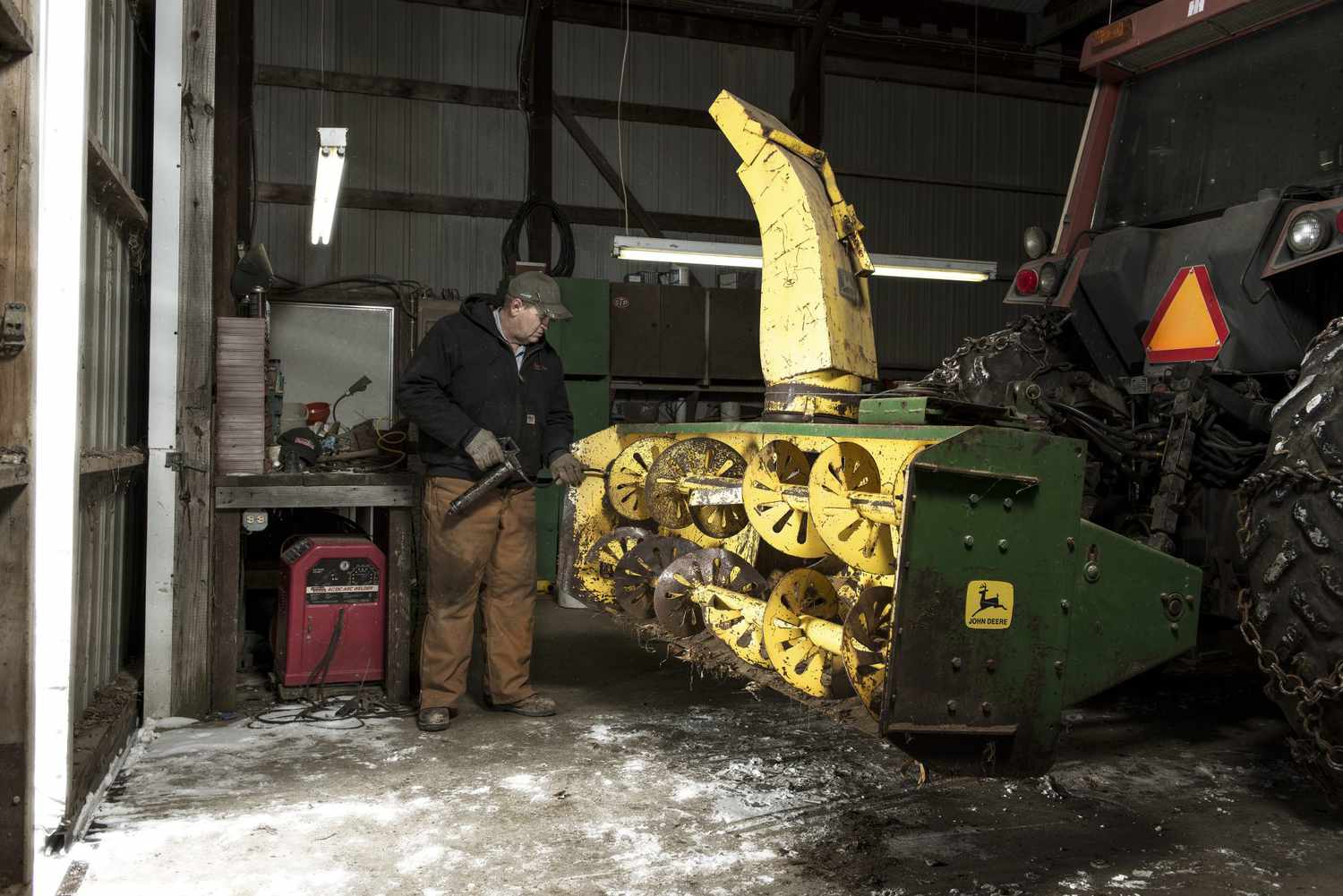 FarmerWorkingInShop WideShot 2000 a6394b02f9e446cdb35b3c54b1131829